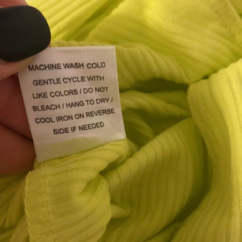 Neon yellow long sleeve sexy body suit. Size small. New with tags